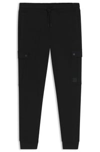 Relaxed-fit cotton-terry tracksuit bottoms with cargo pockets