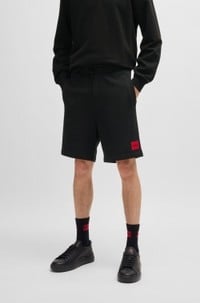 Cotton-terry shorts with red logo label