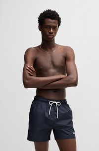 Fully lined swim shorts with contrast logo