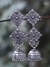 Firoza Oxidized Silver Toned Three Tier Dual Diamond Jhumki