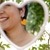 Yellow crochet heart earrings modeled, adding a touch of sunshine to the outfit