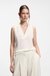 Sleeveless blouse in sandwashed silk with V neckline