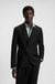 Slim-fit suit jacket with logo closure