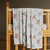 Playful Pedal Pals Muslin Blanket