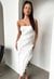 White strapless asymmetrical dress with frills